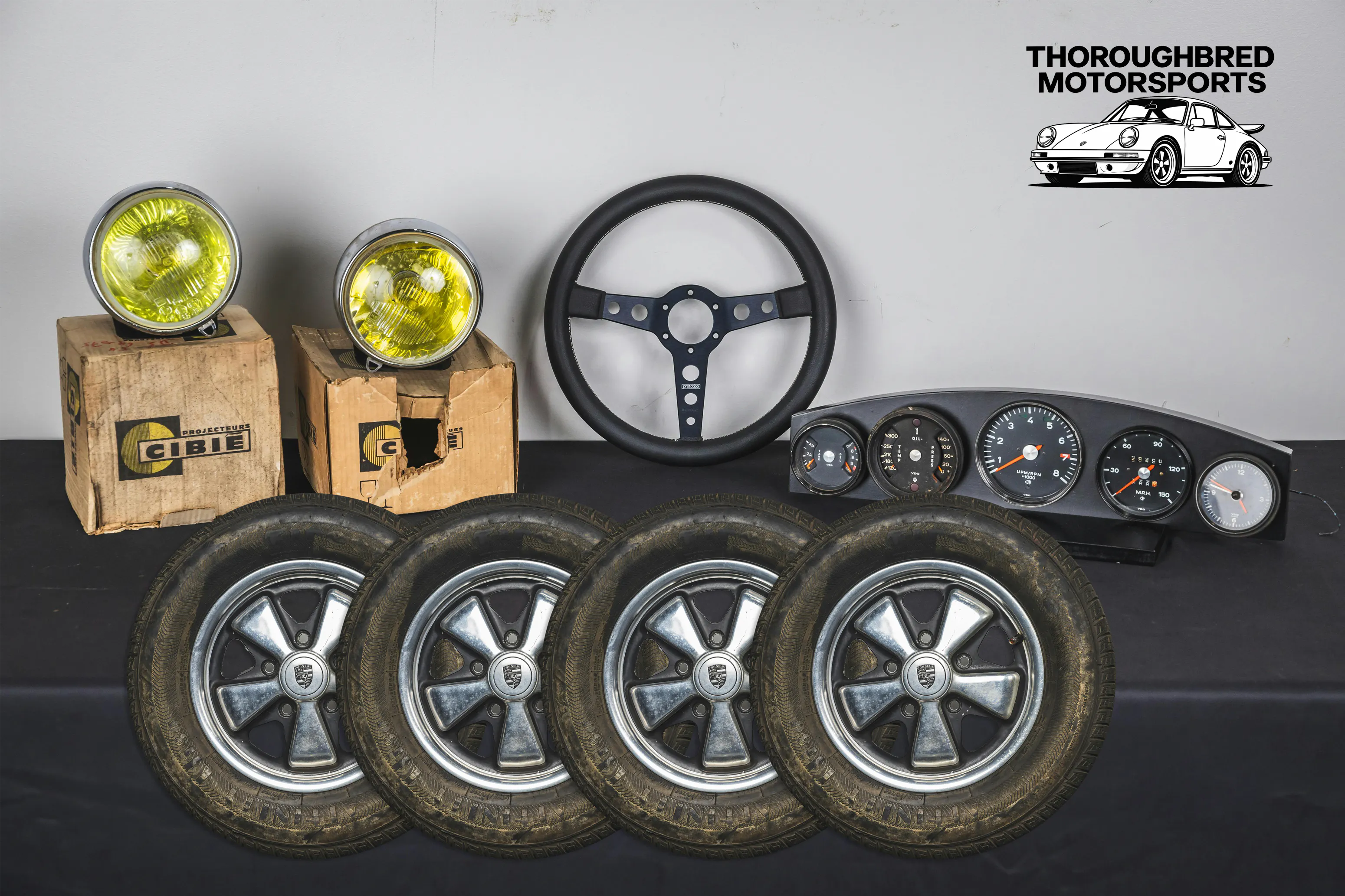  Porsche 911 Fuchs Wheels 5.5x14, '72 911 Gauge Set, Momo Prototipo and Cibie Pallas Hood Lights (Lot 91)