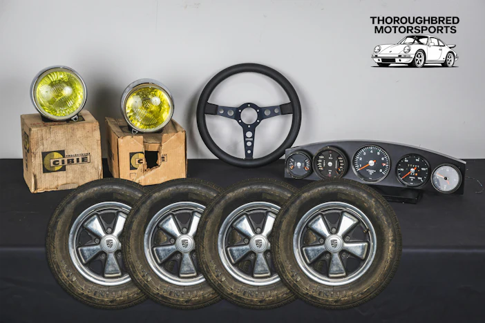 Porsche 911 Fuchs Wheels 5.5x14, '72 911 Gauge Set, Momo Prototipo and Cibie Pallas Hood Lights (Lot 91)