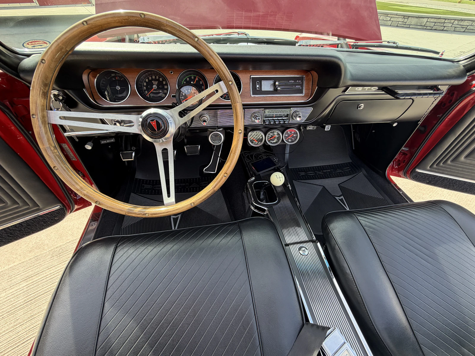 1965 Pontiac GTO black interior with Hurst shifter